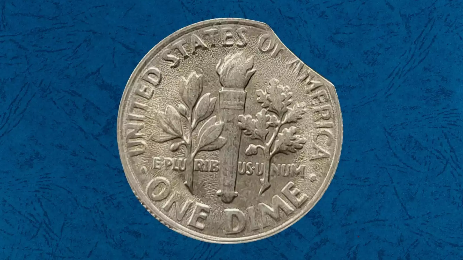 1987 Roosevelt dime clipped planchet error showing curved missing section on coin rim